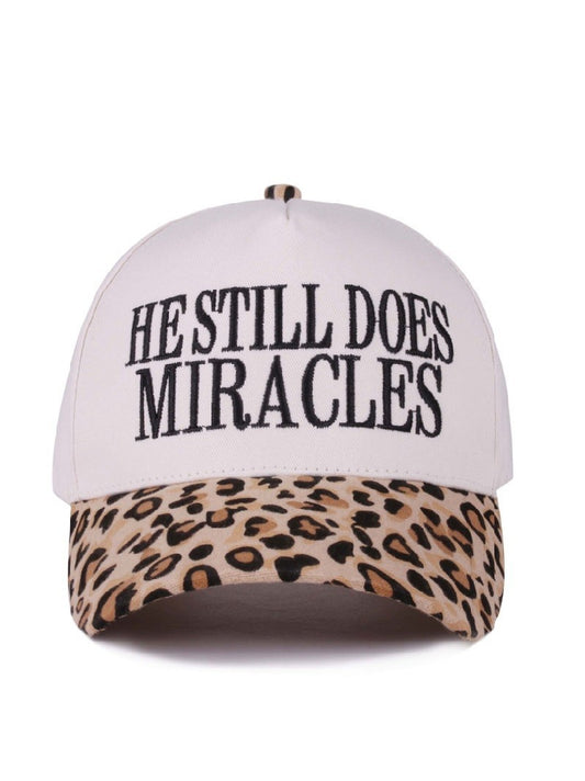 He Still Does Miracles Trucker Hat